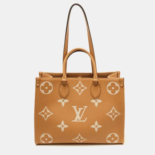 Ivory Monogram Empreinte Leather Onthego MM Tote Bag - Louis Vuitton - Modalova