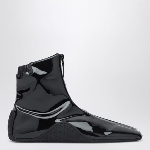 Sneaker nera in tessuto stretch verniciato - Alaïa - Modalova