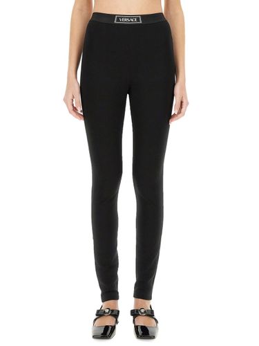 Versace Leggings With Logo - Versace - Modalova