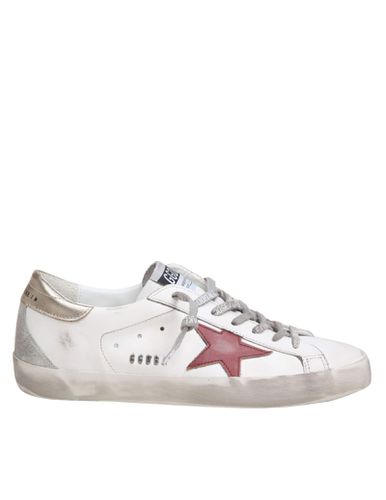 Super Star Sneakers In / And Gold Leather - Golden Goose - Modalova