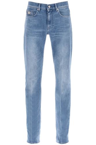 Stretch Denim Slim Fit Jeans - Versace - Modalova