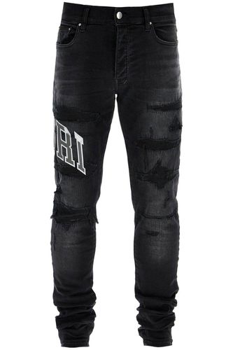 Logo Patch Distressed Skinny Jeans - AMIRI - Modalova