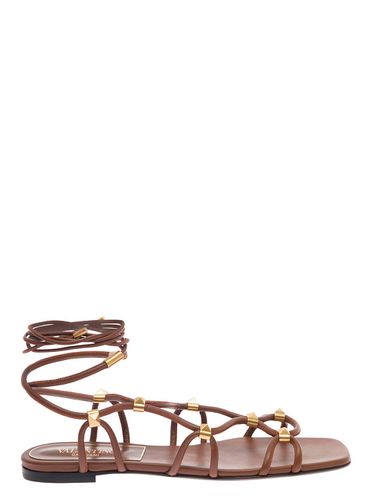 Brown Flat Sandals With Signature Studs And Ankle Strap In Leather Woman - Valentino Garavani - Modalova