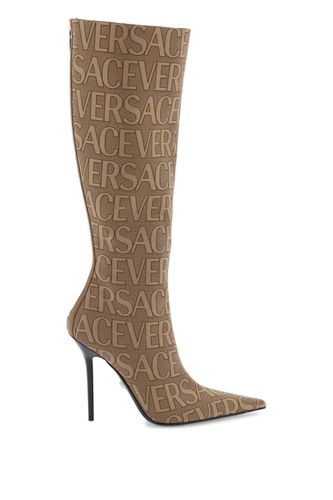 Versace All-over Logo Zipped Boots - Versace - Modalova