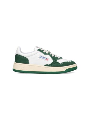 Sneakers In White And Green Leather And Canvas - Autry - Modalova