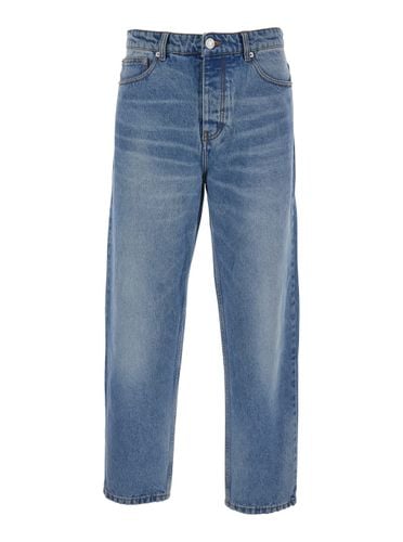 Jeans With Tapered Leg And Logo Patch On The Rear In Denim Man - Ami Alexandre Mattiussi - Modalova