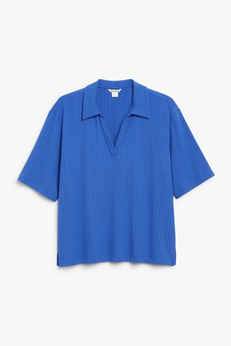 Kurzärmeliges blaues Oversized-Poloshirt Blau, Poloshirts in Größe M. Farbe: - Monki - Modalova