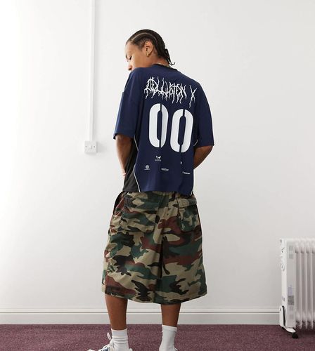 Top stile calcio blu con scollo a V - Collusion - Modalova