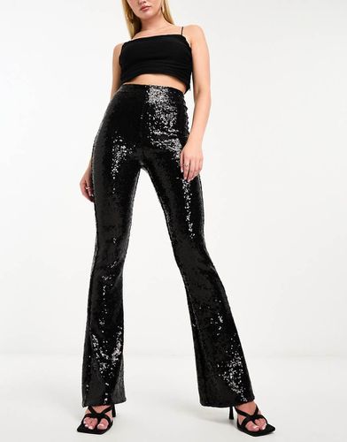 Leggings neri a zampa con paillettes - Commando - Modalova