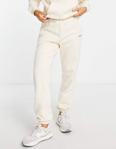 Joggers comodi con logo piccolo crema in coordinato - Carhartt WIP - Modalova