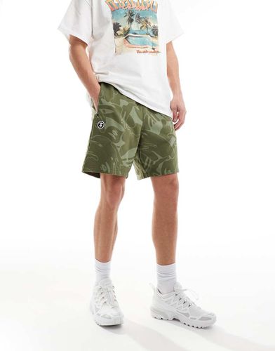 Aape By A Bathing Ape - Pantaloncini in jersey verdi con stampa mimetica - AAPE BY A BATHING APE® - Modalova