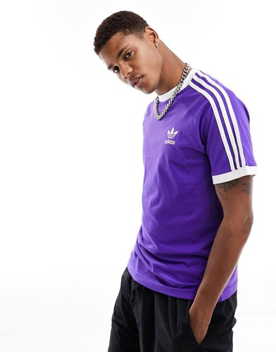 T-shirt viola bluastro con tre strisce - adidas Originals - Modalova