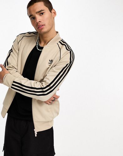 Adicolor - Giacca sportiva beige e nera - adidas Originals - Modalova