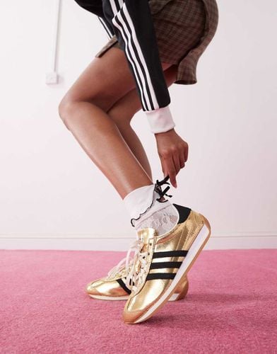 Country OG - Sneakers nere e oro metallizzato - adidas Originals - Modalova