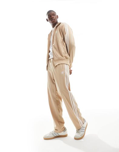 Firebird - Pantaloni sportivi beige - adidas Originals - Modalova