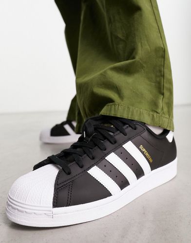 Superstar - Sneakers nere con strisce bianche - adidas Originals - Modalova
