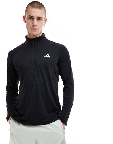 Adidas - Training Essentials - Maglietta nera con zip corta - adidas performance - Modalova