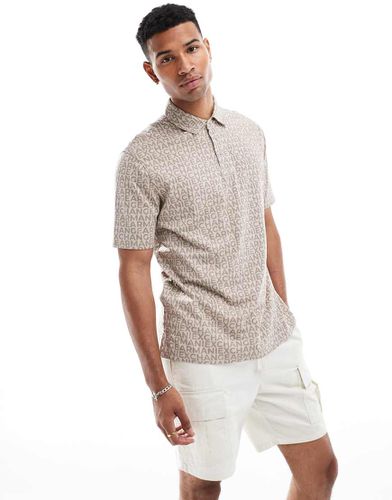 Polo beige con lettere tono su tono - Armani Exchange - Modalova