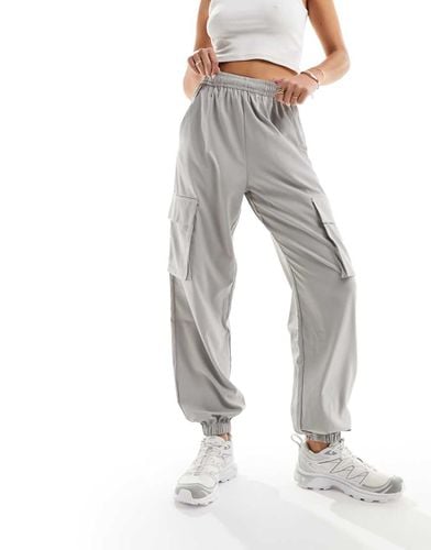 Pantaloni cargo a vita alta chiaro - ASOS - Modalova