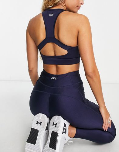 Reggiseno sportivo a supporto medio lucido - ASOS - Modalova