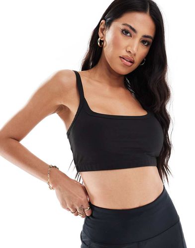 Reggiseno sportivo morbido a supporto medio con imbottitura rimovibile - ASOS - Modalova