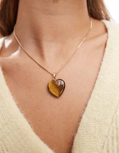 Collana dorata con ciondolo a cuore effetto occhio di tigre - ASOS DESIGN - Modalova