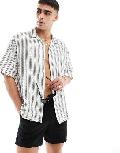Camicia oversize nera e bianca a righe con rever - ASOS DESIGN - Modalova