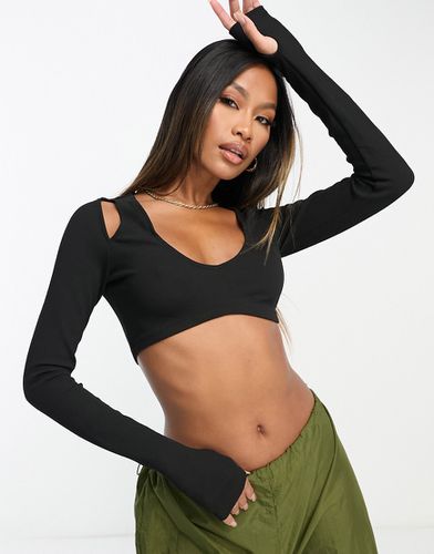 Crop top con cut-out sulla spalla - ASOS DESIGN - Modalova