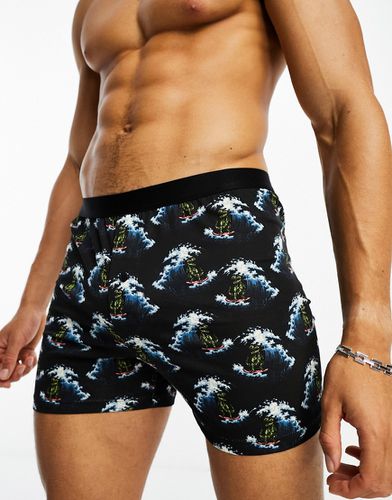 Boxer neri con stampa di dinosauri sul surf - ASOS DESIGN - Modalova