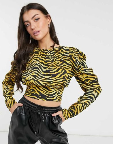 Blusa con maniche lunghe e voluminose e stampa tigrata - ASOS DESIGN - Modalova