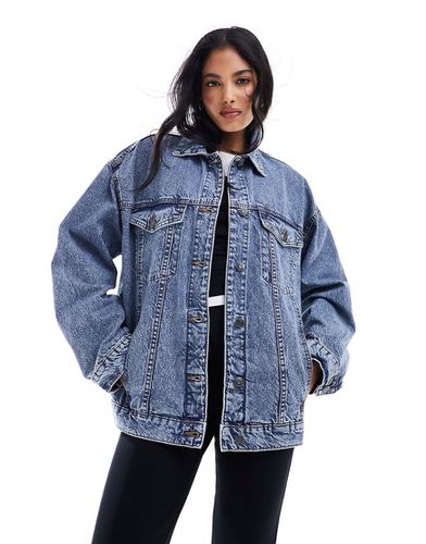Giacca di jeans oversize anni '90 lavaggio medio - ASOS DESIGN - Modalova