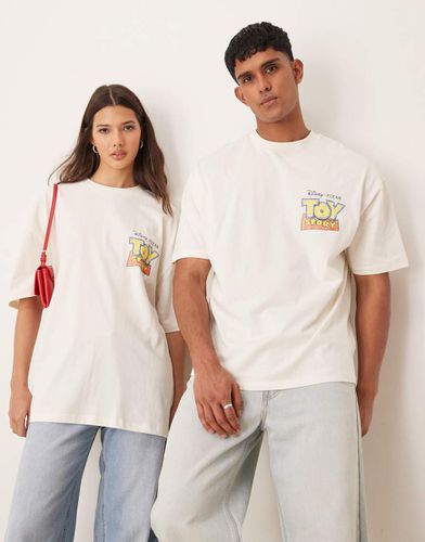 Disney Pixar - T-shirt unisex oversize beige con stampe "Toy Story" stilizzate - ASOS DESIGN - Modalova