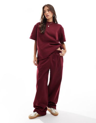 Joggers oversize a cilindro bordeaux in coordinato - ASOS DESIGN - Modalova