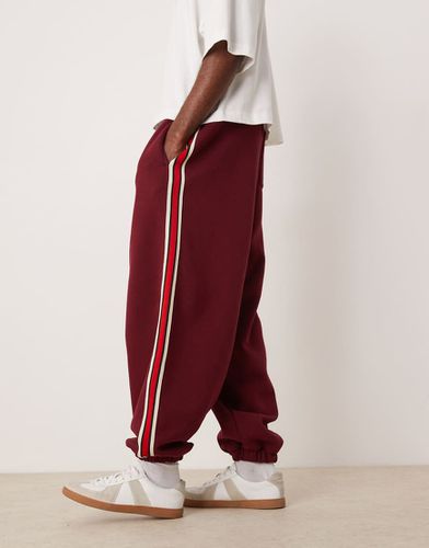 Joggers oversize a palloncino color bordeaux con fettuccia a contrasto - ASOS DESIGN - Modalova