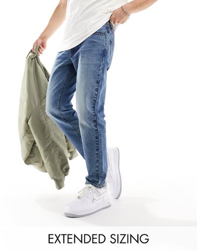 Jeans classici rigidi lavaggio scuro tinto - ASOS DESIGN - Modalova