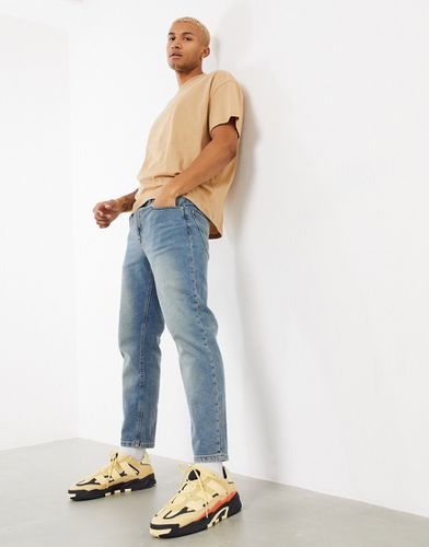 Jeans classici rigidi slavato effetto sporco vintage - ASOS DESIGN - Modalova