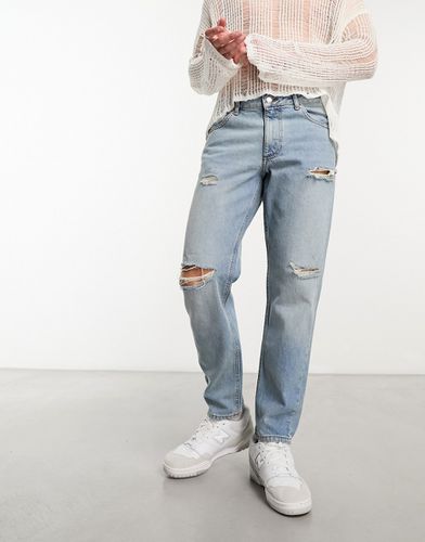 Jeans classici rigidi color medio con strappi - ASOS DESIGN - Modalova