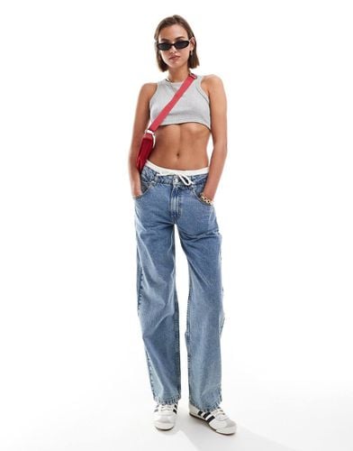 Jeans ampi lavaggio chiaro con dettaglio stile boxer in vita - ASOS DESIGN - Modalova