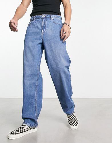 Jeans ampi lavaggio medio - ASOS DESIGN - Modalova
