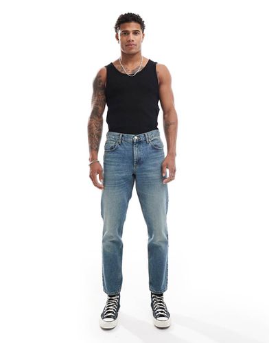 Jeans affusolati lavaggio scuro tinto - ASOS DESIGN - Modalova