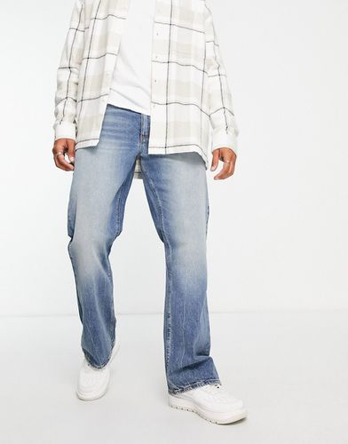 Jeans bootcut lavaggio scuro tinto - ASOS DESIGN - Modalova