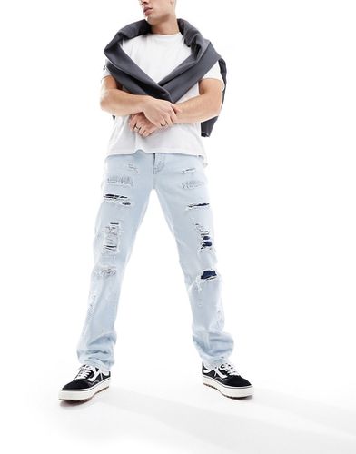 Jeans dritti lavaggio chiaro con strappi e dettagli riparati - ASOS DESIGN - Modalova