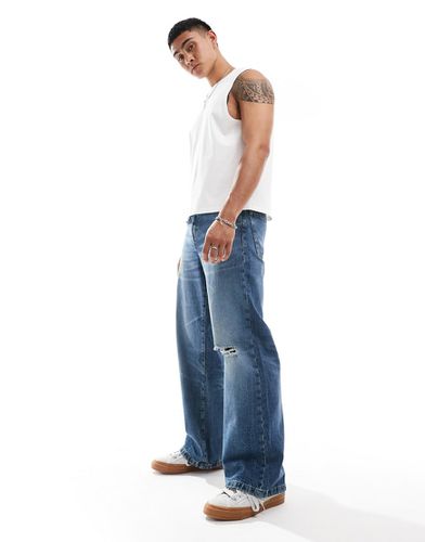 Jeans larghi con fondo ampio lavaggio medio - ASOS DESIGN - Modalova