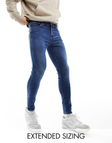 Jeans spray power stretch lavaggio scuro - ASOS DESIGN - Modalova