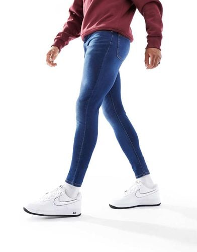 Jeans spray power stretch lavaggio scuro - ASOS DESIGN - Modalova