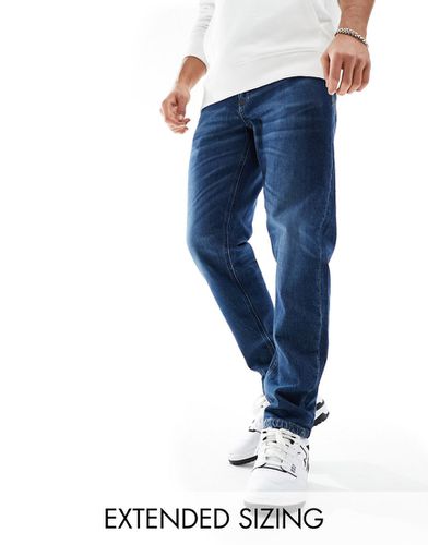Jeans stretch affusolati lavaggio vintage scuro - ASOS DESIGN - Modalova