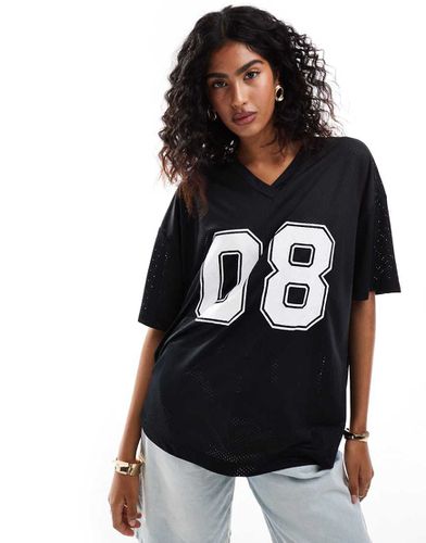 Maglia da calcio stile college oversize nera con stampa grafica - ASOS DESIGN - Modalova