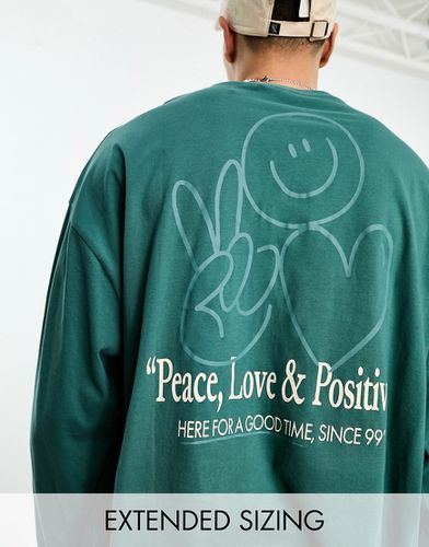 Maglietta a maniche lunghe oversize verde con stampa "Peace" sul retro - ASOS DESIGN - Modalova