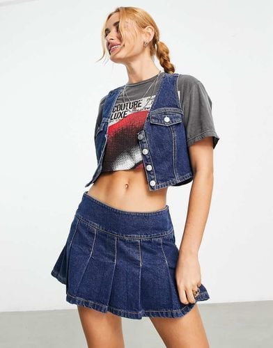 Minigonna in denim medio a pieghe in coordinato - ASOS DESIGN - Modalova