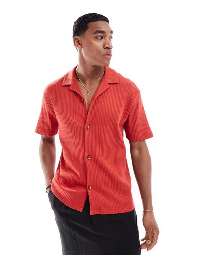 Polo rossa a coste vestibilità comoda - ASOS DESIGN - Modalova